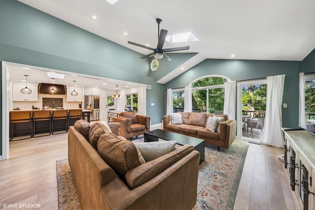 5525 Lee Ave, Downers Grove, IL 60515 - living room featuring a skylight, light wood-style floors, recessed lighting, a ceiling fan, and high vaulted ceiling