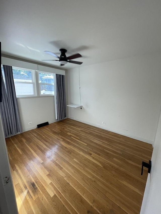 12813 E Playfield Dr, Crestwood, IL 60418 - empty room featuring wood finished floors and a ceiling fan