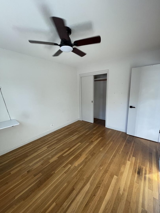 12813 E Playfield Dr, Crestwood, IL 60418 - unfurnished bedroom with wood finished floors, a closet, and a ceiling fan