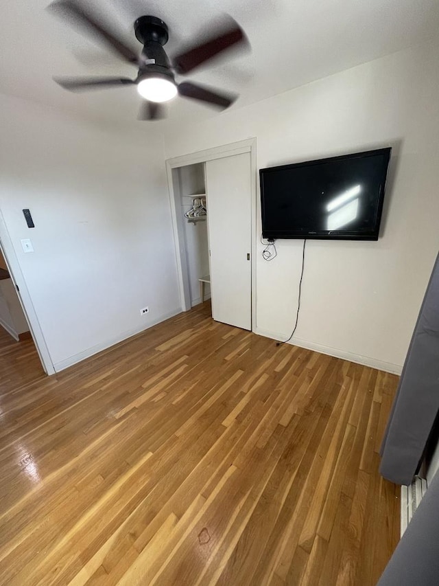 12813 E Playfield Dr, Crestwood, IL 60418 - unfurnished bedroom featuring wood finished floors, a closet, and ceiling fan