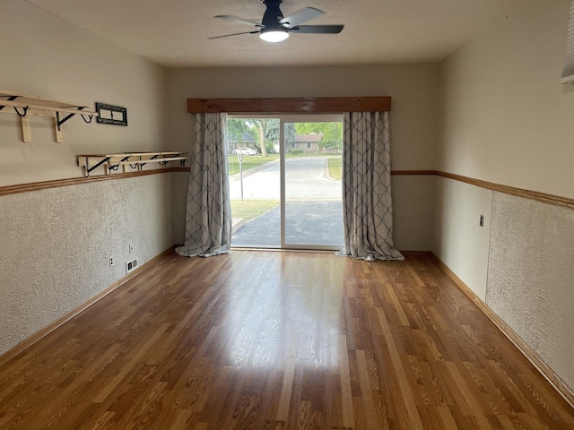 12813 E Playfield Dr, Crestwood, IL 60418 - unfurnished room with wood finished floors, ceiling fan, and a textured wall