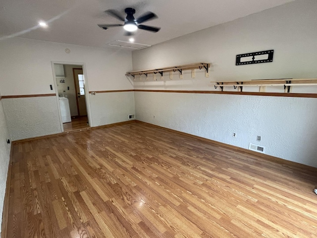 12813 E Playfield Dr, Crestwood, IL 60418 - unfurnished room with wood finished floors, washer / clothes dryer, a ceiling fan, and a textured wall