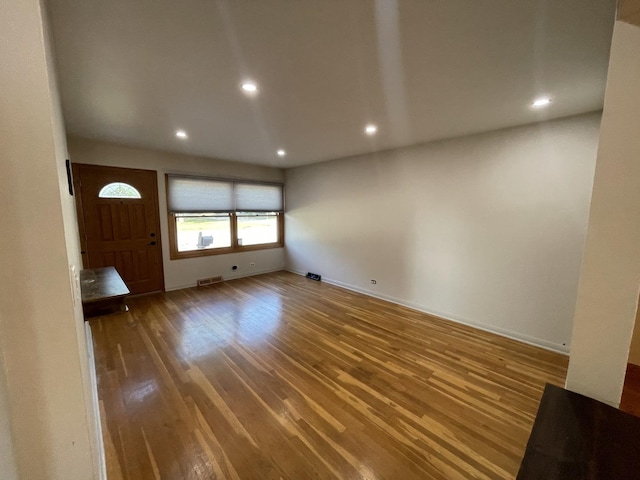 12813 E Playfield Dr, Crestwood, IL 60418 - unfurnished living room featuring wood finished floors and recessed lighting