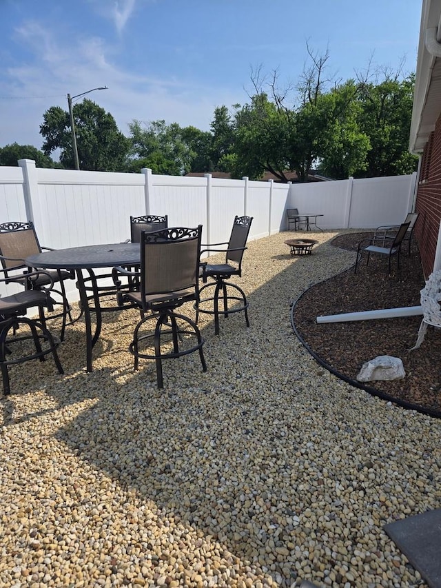 12813 E Playfield Dr, Crestwood, IL 60418 - view of patio with outdoor dining area and a fire pit