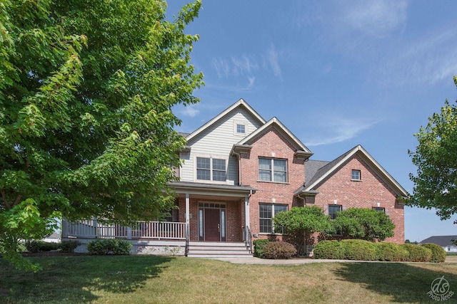 1019 Freedom Cir, Sycamore, IL 60178 - view of front facade featuring brick siding, a porch, and a front yard