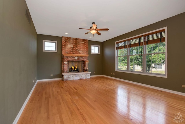 1019 Freedom Cir, Sycamore, IL 60178 - unfurnished living room featuring a ceiling fan, healthy amount of natural light, and light wood finished floors