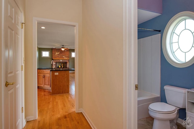 1019 Freedom Cir, Sycamore, IL 60178 - full bathroom featuring wood finished floors, ceiling fan, shower / tub combination, and vanity