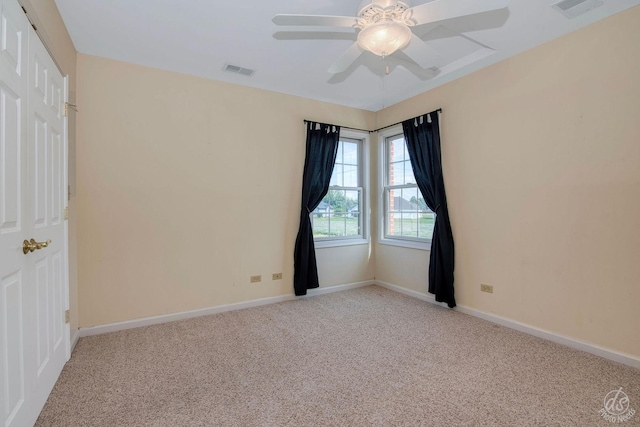 1019 Freedom Cir, Sycamore, IL 60178 - spare room featuring light carpet and ceiling fan