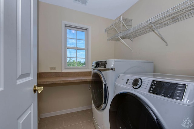 1019 Freedom Cir, Sycamore, IL 60178 - laundry area with washer and dryer and light tile patterned flooring