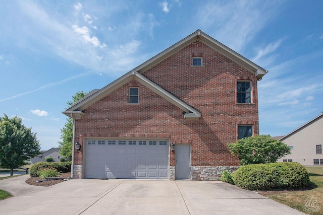 1019 Freedom Cir, Sycamore, IL 60178 - view of property exterior featuring concrete driveway, brick siding, and stone siding