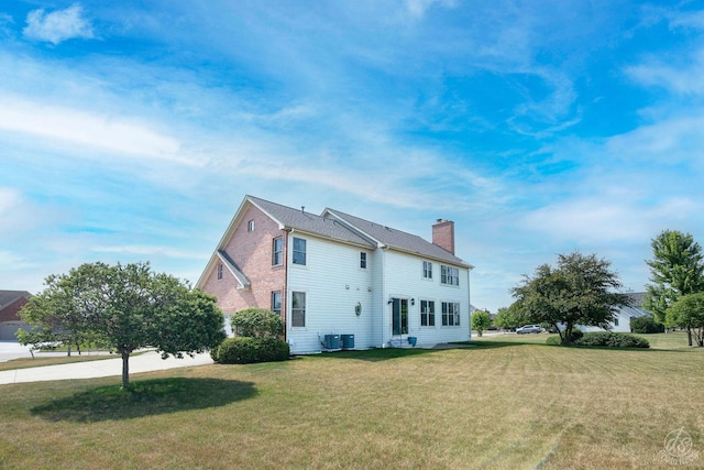 1019 Freedom Cir, Sycamore, IL 60178 - view of property exterior with a chimney and a lawn