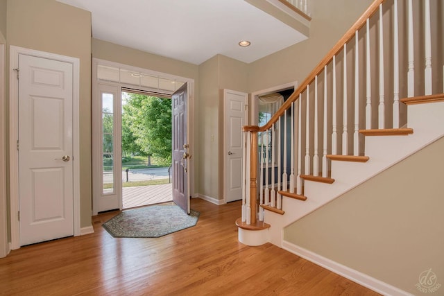 1019 Freedom Cir, Sycamore, IL 60178 - entrance foyer with light wood-style floors and stairway