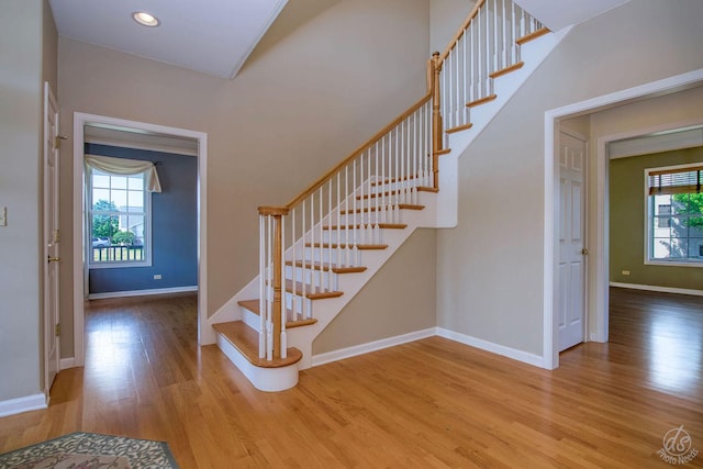 1019 Freedom Cir, Sycamore, IL 60178 - entrance foyer with wood finished floors, plenty of natural light, stairway, and recessed lighting