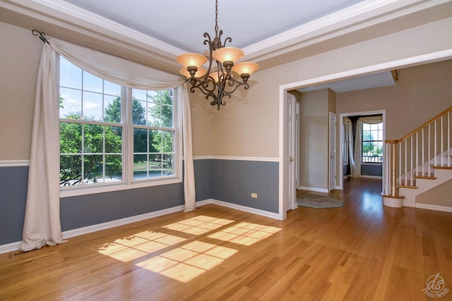 1019 Freedom Cir, Sycamore, IL 60178 - empty room with a chandelier, light wood-type flooring, stairs, and crown molding
