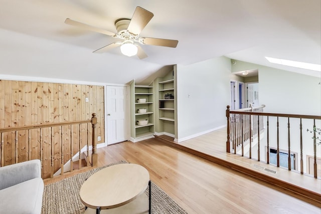 100 W Willow Rd, Prospect Heights, IL 60070 - sitting room with lofted ceiling, an upstairs landing, built in features, a skylight, and light wood-type flooring