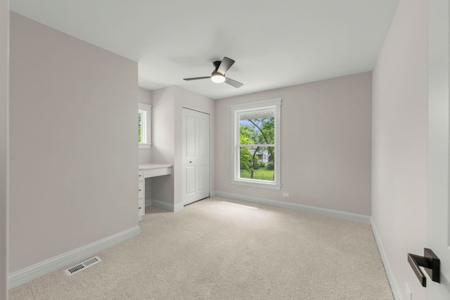 342 Franklin Ave, River Forest, IL 60305 - unfurnished bedroom with light carpet, a closet, an office area, and a ceiling fan