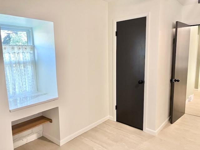 909 N Brinton Ave, Dixon, IL 61021 - unfurnished bedroom with baseboards