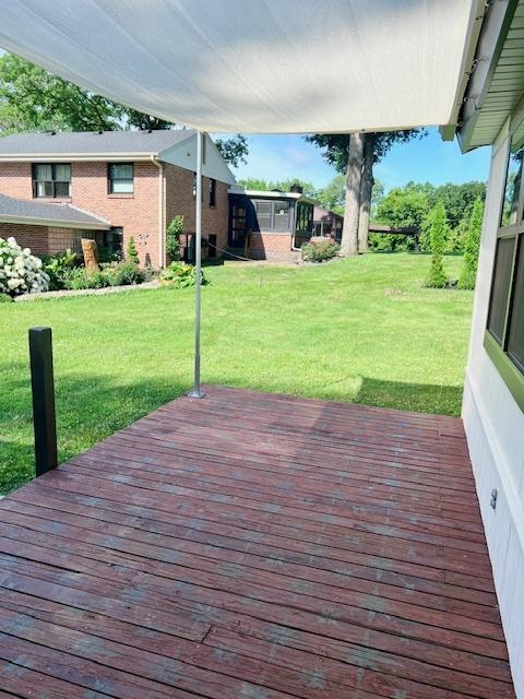 909 N Brinton Ave, Dixon, IL 61021 - deck featuring a lawn