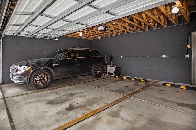 2304 W Jackson Blvd Unit 2W, Chicago, IL 60612 - parking garage with a garage door opener and concrete block wall