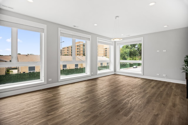 2304 W Jackson Blvd Unit 2W, Chicago, IL 60612 - unfurnished living room featuring dark wood-style floors and recessed lighting