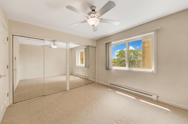310 Lathrop Ave Unit 411, Forest Park, IL 60130 - unfurnished bedroom with a baseboard heating unit, multiple closets, and carpet