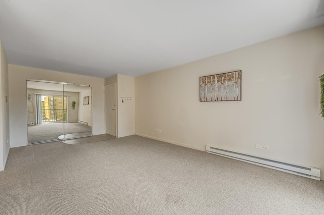 310 Lathrop Ave Unit 411, Forest Park, IL 60130 - unfurnished room with a baseboard radiator and carpet