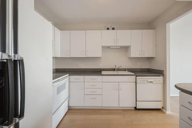 405 N Wabash Ave Unit 3611, Chicago, IL 60611 - kitchen with white appliances, dark countertops, white cabinetry, and light wood-type flooring
