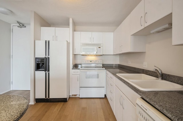 405 N Wabash Ave Unit 3611, Chicago, IL 60611 - kitchen with white appliances, light wood-style floors, white cabinetry, and dark countertops