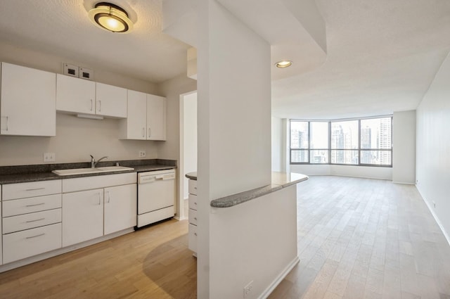 405 N Wabash Ave Unit 3611, Chicago, IL 60611 - kitchen featuring dishwasher, light wood-style flooring, white cabinets, dark countertops, and recessed lighting
