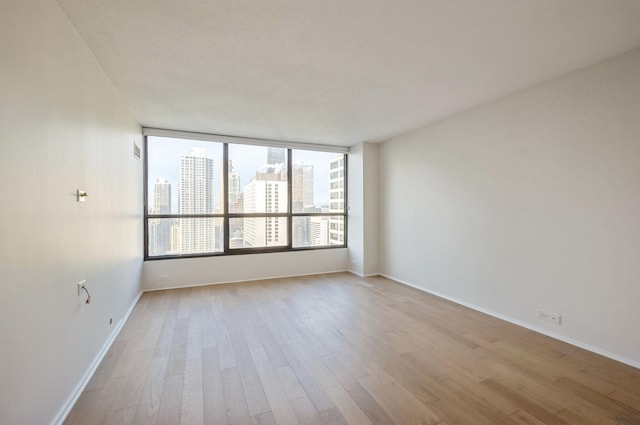 405 N Wabash Ave Unit 3611, Chicago, IL 60611 - spare room with light wood-style flooring and a view of city