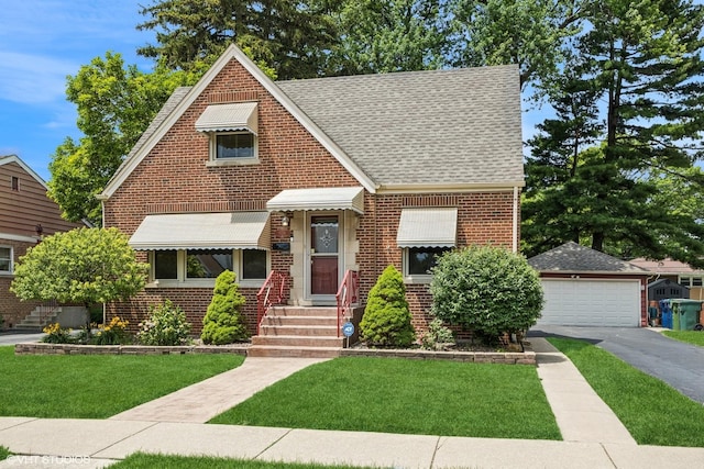 9326 S Millard Ave, Evergreen Park, IL 60805 - tudor home featuring brick siding, a front lawn, roof with shingles, and a garage