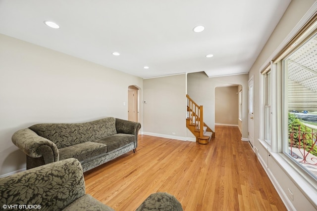 9326 S Millard Ave, Evergreen Park, IL 60805 - living area featuring arched walkways, stairway, light wood finished floors, and recessed lighting