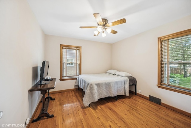 9326 S Millard Ave, Evergreen Park, IL 60805 - bedroom with light wood finished floors and ceiling fan