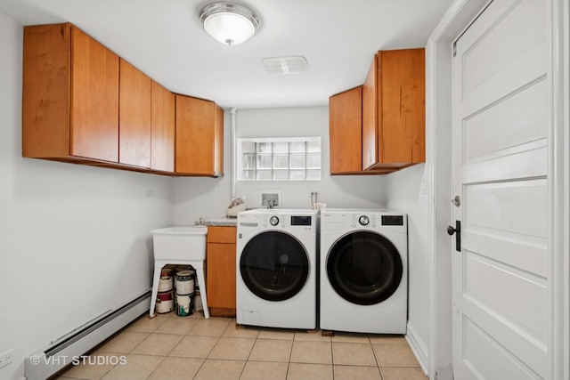 6046 N Monitor Ave, Chicago, IL 60646 - laundry area featuring a baseboard heating unit, cabinet space, washing machine and clothes dryer, and light tile patterned floors