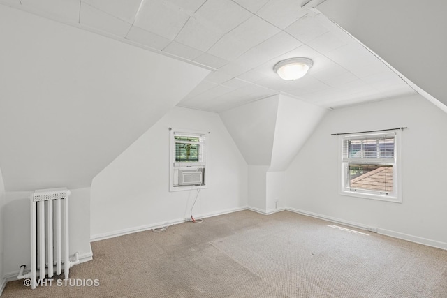 6046 N Monitor Ave, Chicago, IL 60646 - additional living space featuring radiator heating unit, carpet flooring, vaulted ceiling, and cooling unit