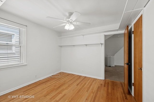 6046 N Monitor Ave, Chicago, IL 60646 - unfurnished bedroom with light wood finished floors, a closet, and a ceiling fan