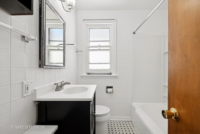 6046 N Monitor Ave, Chicago, IL 60646 - bathroom featuring tile walls, vanity, shower / bathtub combination, and tile patterned floors