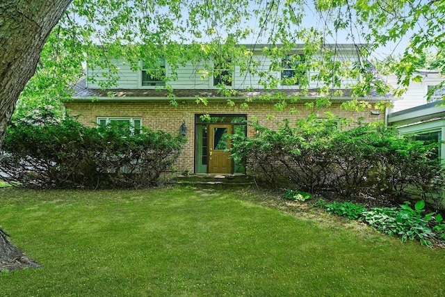 600 Riverwoods Rd, Mettawa, IL 60045 - back of property with brick siding and a yard