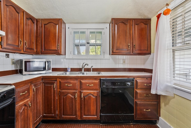 705 Arlington Ct, Champaign, IL 61820 - kitchen featuring dishwasher, stainless steel microwave, range, a textured ceiling, and decorative backsplash
