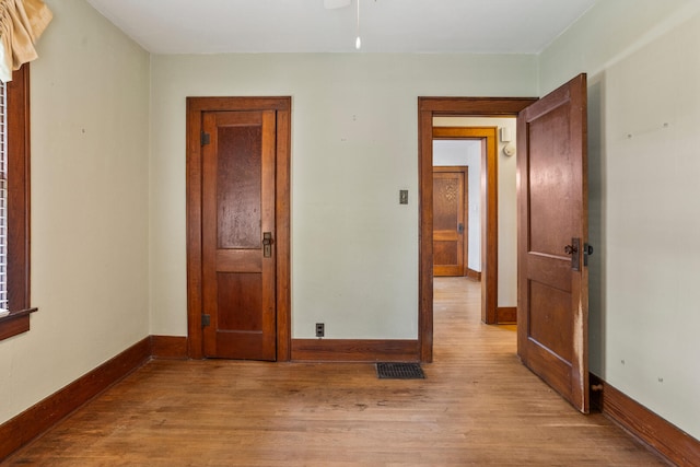 705 Arlington Ct, Champaign, IL 61820 - unfurnished room with wood finished floors and baseboards