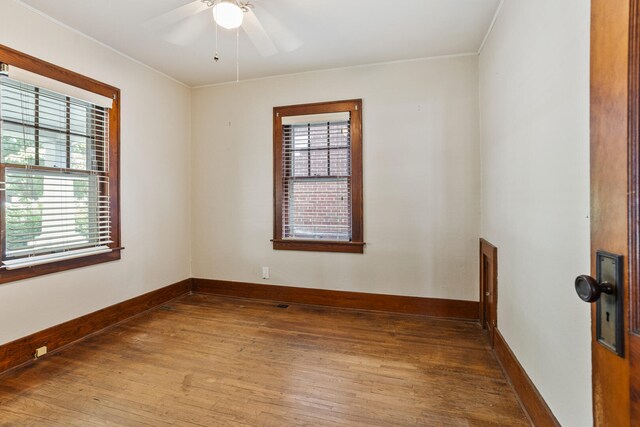 705 Arlington Ct, Champaign, IL 61820 - unfurnished room featuring light wood-type flooring, ceiling fan, and crown molding