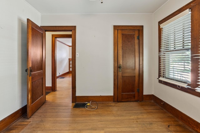 705 Arlington Ct, Champaign, IL 61820 - spare room featuring wood finished floors and ornamental molding
