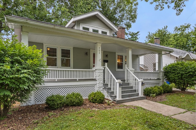 705 Arlington Ct, Champaign, IL 61820 - bungalow-style house featuring a porch and a chimney