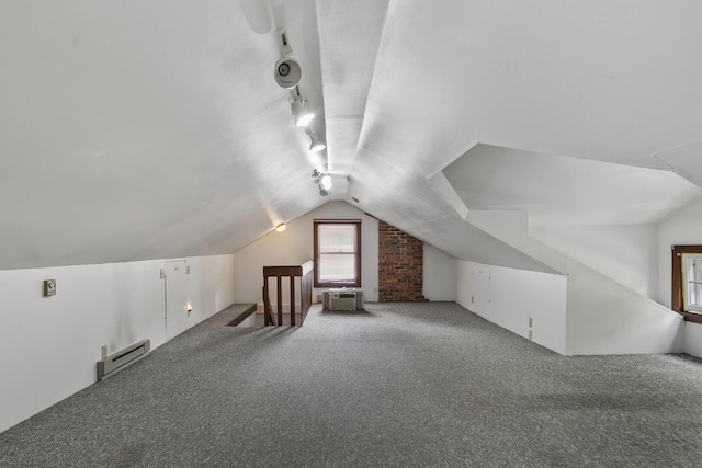 705 Arlington Ct, Champaign, IL 61820 - additional living space featuring a baseboard radiator, carpet floors, and vaulted ceiling