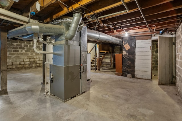 705 Arlington Ct, Champaign, IL 61820 - unfinished basement featuring stairway and heating unit