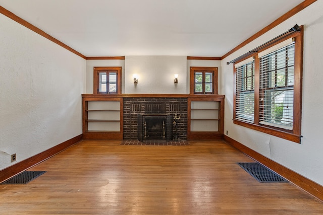 705 Arlington Ct, Champaign, IL 61820 - unfurnished living room featuring ornamental molding, wood-type flooring, plenty of natural light, and a fireplace