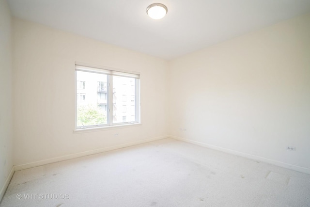 1660 1st St Unit 303, Highland Park, IL 60035 - spare room featuring carpet floors and baseboards