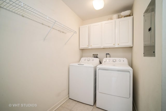 1660 1st St Unit 303, Highland Park, IL 60035 - laundry room featuring cabinet space, electric panel, washing machine and dryer, and light tile patterned flooring