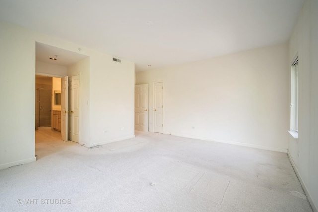 1660 1st St Unit 303, Highland Park, IL 60035 - empty room with light colored carpet and baseboards