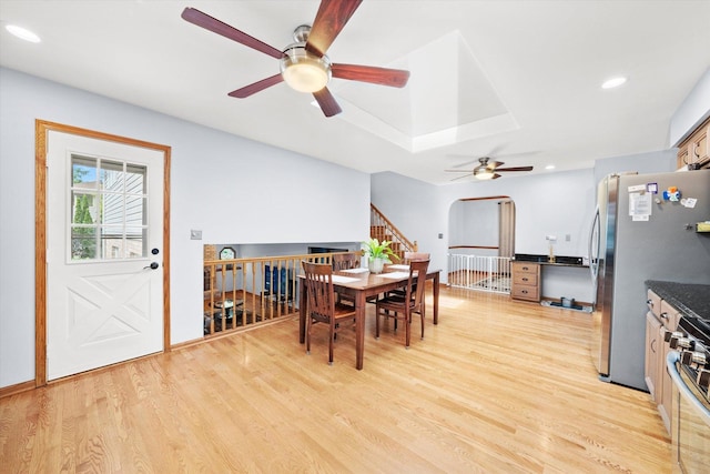 5724 W 82nd Pl, Burbank, IL 60459 - dining area featuring ceiling fan, light wood-style flooring, recessed lighting, arched walkways, and stairway